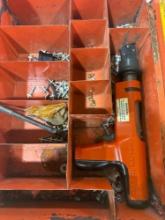 Metal oragnizer with Hilti DX 200 and various items
