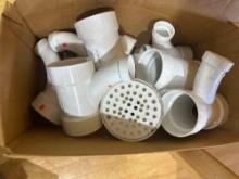 PVC fittings and a floor drain measurements in photo