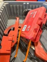 Tote with PVC pipe cutter, wall hanger, drill bits and other various items