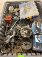 Tote contains hole saw bits, roofing nails, drill bits, and other misc items