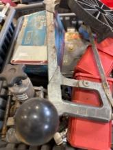 Tote contains hand saw, air spray gun, and various misc items