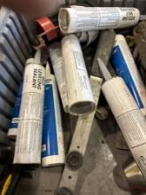 Several tubes of self leveling sealant, and other various items