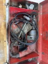 Red tool case with corded drill and other items