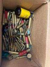 box of ammunition and brass