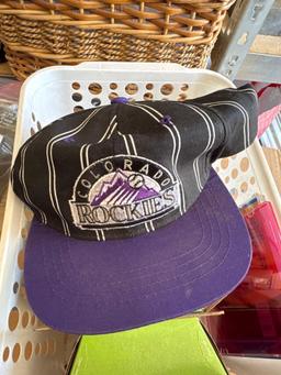 HP printer cartridges and a Colorado Rockies hat