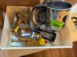 Small sifter, thermometers, egg separators, wine bottle opener in tray