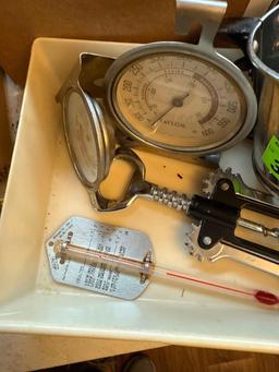 Small sifter, thermometers, egg separators, wine bottle opener in tray