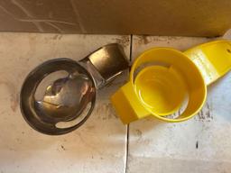 Small sifter, thermometers, egg separators, wine bottle opener in tray