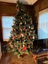 Approximately 10ft. Christmas tree with ornaments. Be prepared to take tree down Bring help to