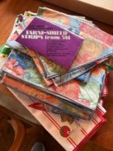 Box full of napkins, placemats, tablecloths,