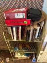 Metal shelf, cookbooks, home decor, wicker basket, and more