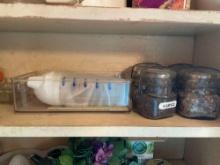 Contents on 2nd shelf, spice jars, organizing trays, cupcake molds, toothpicks, and more