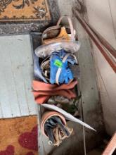 Baskets with gardening tools and gloves, clothes pins, plant food