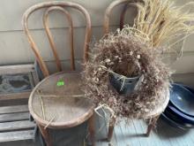 2 old chairs, earth, bucket of wheat, wheelbarrow planter
