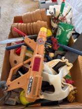 Tennis balls, toy, gun, ankle, weights, toy, cars, pens, and pencils and cups and more