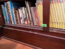 Books, whole bottom shelf, and metal book ends. See photos for titles and authors