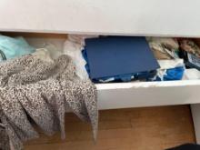 Contents In middle drawer of dresser, pajama gowns, waterproof phone pouches, vintage WWII Korea War