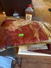 Picture frames, rug, bottle of oil soap cleaner and bottle of lemon oil cleaner