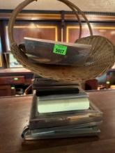 Woven decor basket, multiple picture frames, and silver dish