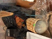 Woven basket with cactus, bag of fall decor leaves, broom, Stewart tuning radio and more
