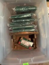 Storage tote with several Christmas wreath storage bags, wooden hanging shelf