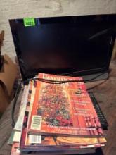 Vizio tv with remote and magazines