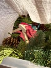 Tote of Christmas garland and decor