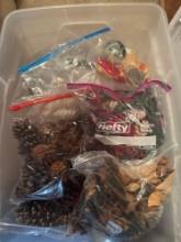 Tote with misc items, pine cones, stockings, and bell wreath