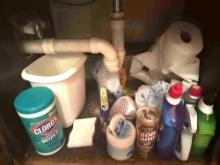 Cleaning supplies under cabinet