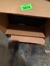 Box with picture frames and small gold lamp