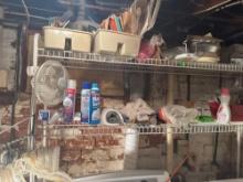 Metal shelves included, fan, cleaning supplies, all contents on racks