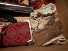 Box of old baby shoes, flashlight, glasses, more