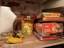 Everything on shelf, games, art supplies, paper roll, owl hanging