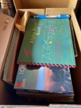 Box of kids puzzles and puzzle books