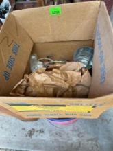 Bucket with yard games (dice and bean bags), box with outlet covers, outlet replacements, twin hose