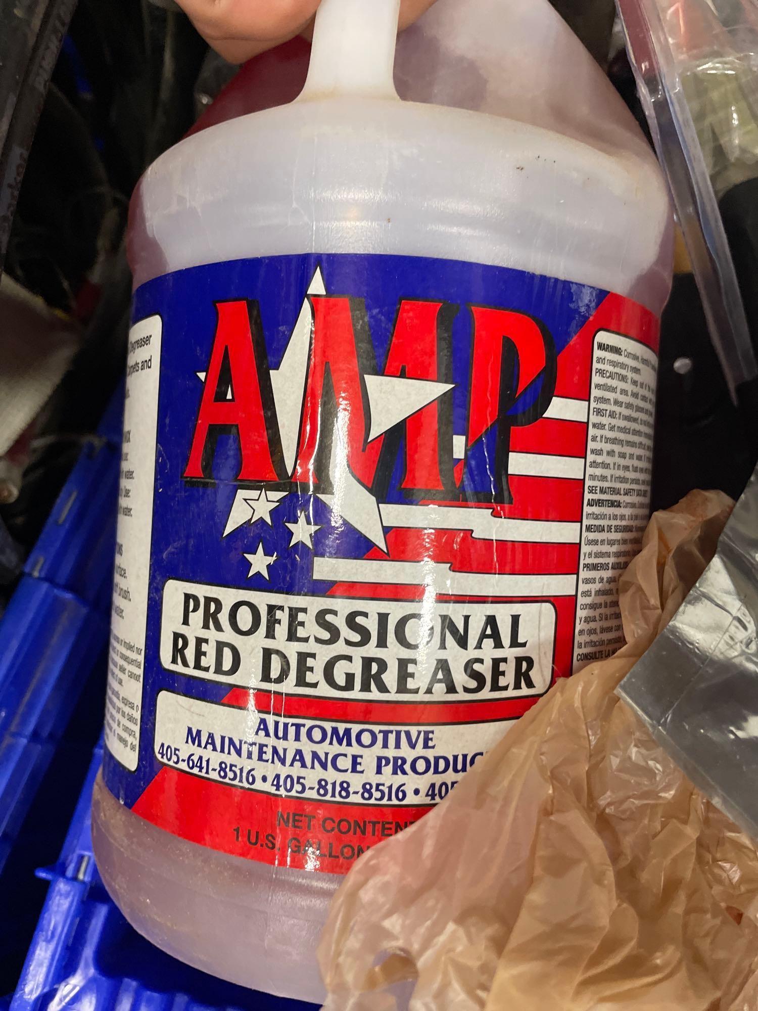tub of adhesive remover; degreaser; paint rollers