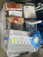 tub of various light bulbs; wine bottle glass