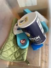 clear tote with house slippers; salt; pot holder