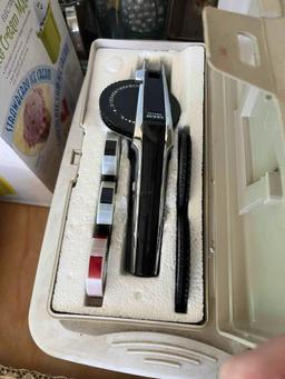 Small tote with stamps, label maker in case and hole punch