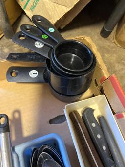Kitchen items, silverware, measuring cups, wicker basket, and other various kitchen items