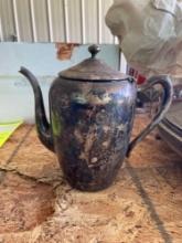 Likely a silver plated teapot