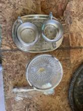 Silver plated serving tray with two accompany pieces, likely creamer and sugar bowl