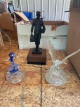 Trophy, glass bird, and glass whale