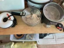 Donut bite maker, pressure cooker, Presto fryer and a box with koozies, 2 plastic containers and