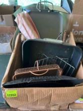 Box with BBQ trays, BBQ cooking utensils, and other pans