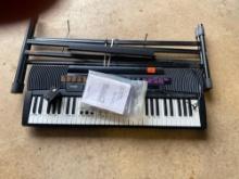 Casio CTK-520L keyboard with stand