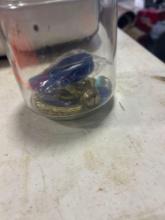 Glass jar with marbles and other misc items