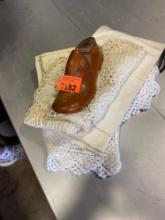 Vintage wooden shoe form and crochet table cloths