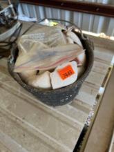 Bucket with rocks and seashells