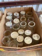 Various sizes of canning jars, some with lids